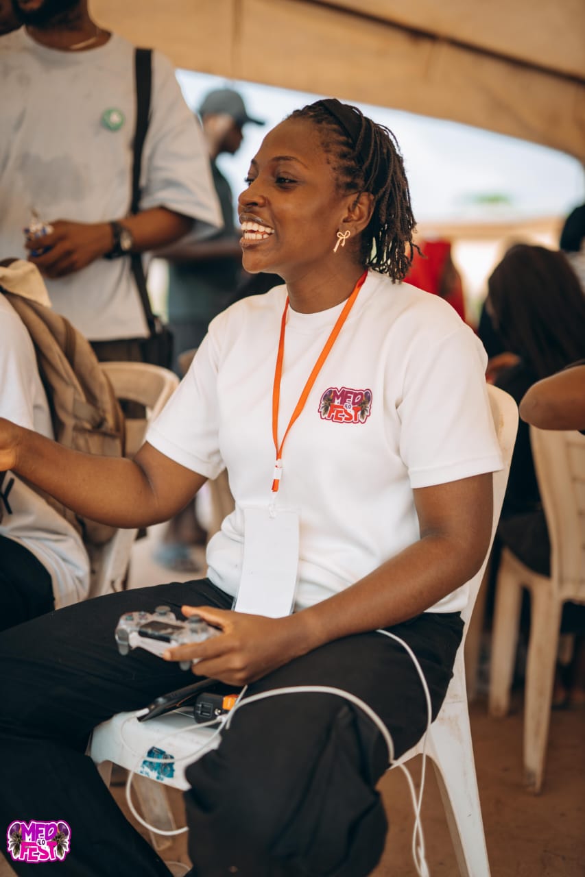 A guest with a lanyard seated at a desk